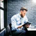 CEO reading business magazine