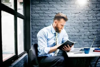 CEO reading business magazine