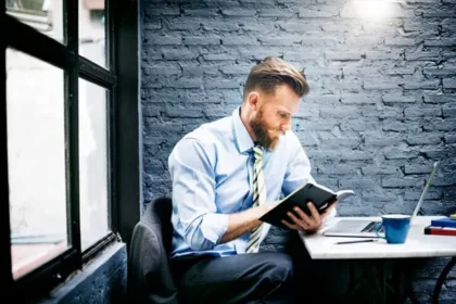CEO reading business magazine