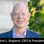 Bret L. England, CEO & President