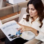 Business professional reading magazine