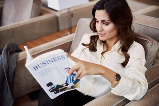 Business professional reading magazine