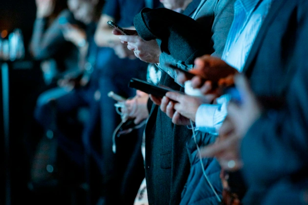 people using phone while standing people using phone while standing