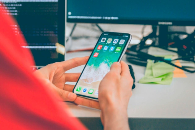 person using silver iphone person using silver iphone