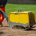 A vibratory plate compactor turns up at every stage of building