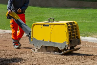 A vibratory plate compactor turns up at every stage of building